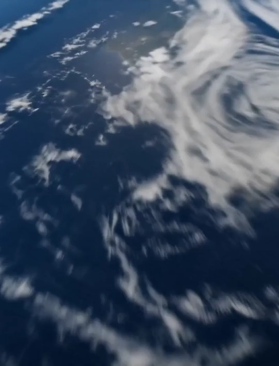 Earth zoom from space down to a city skyline